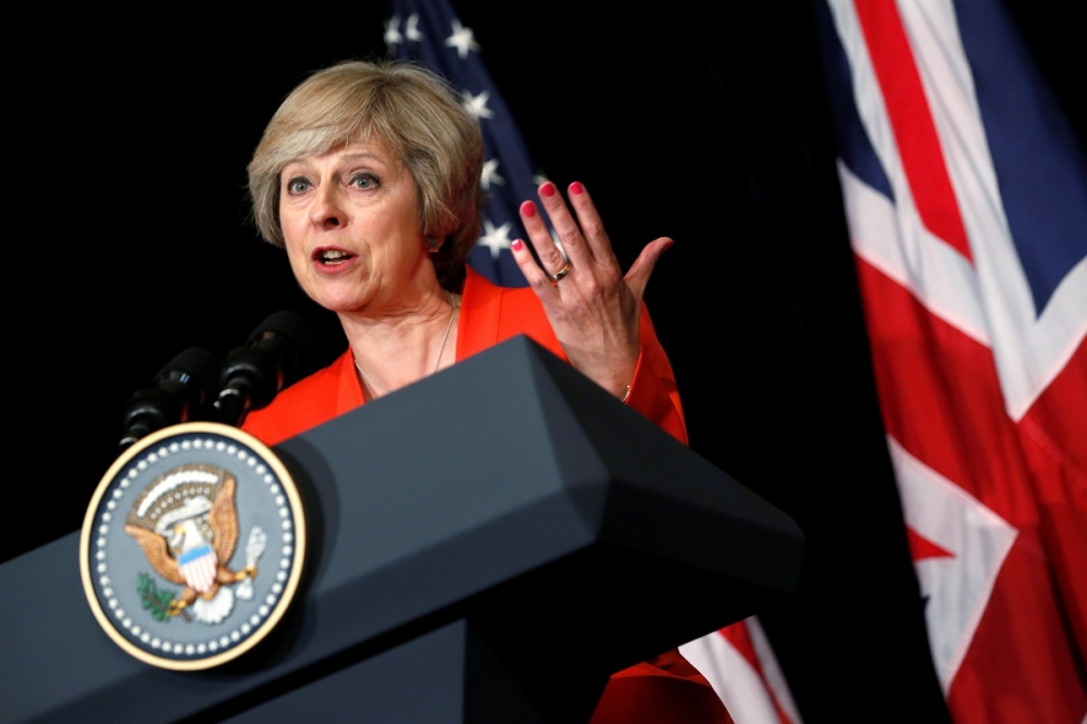 英國首相梅伊在英美聯合記者會上回答問題。（湯森路透）