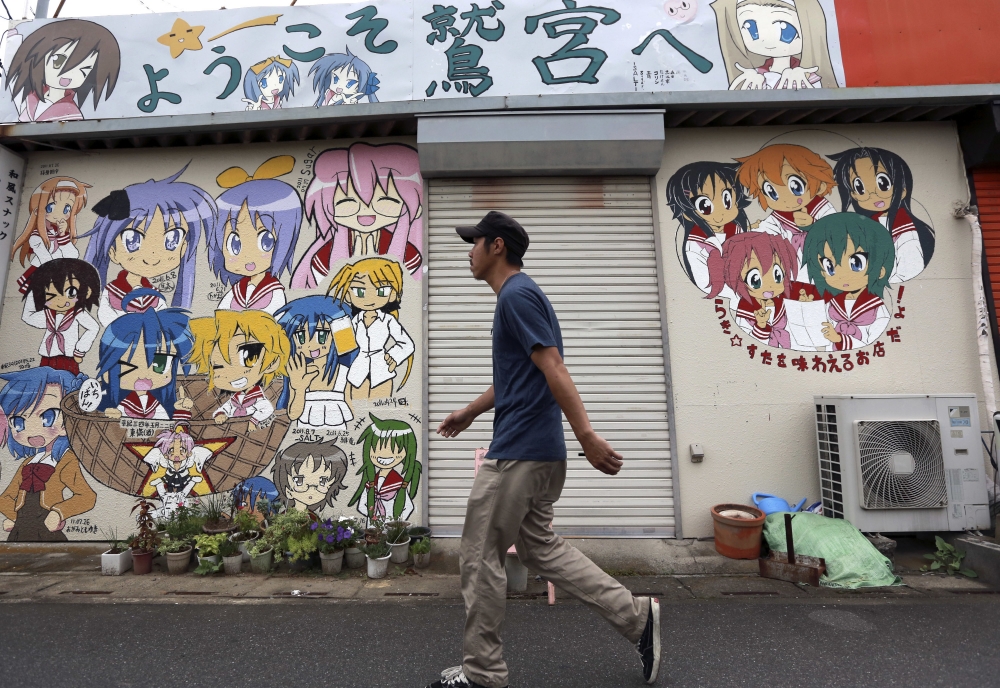 日本街道上可見到知名動漫人物的塗鴉。（美聯社）