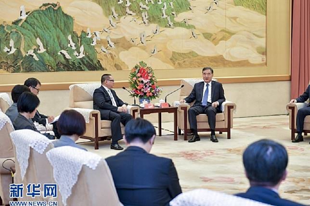 聯合報系董事長王文杉24日率團會見中國政協主席汪洋。（圖片取自中國新華網）