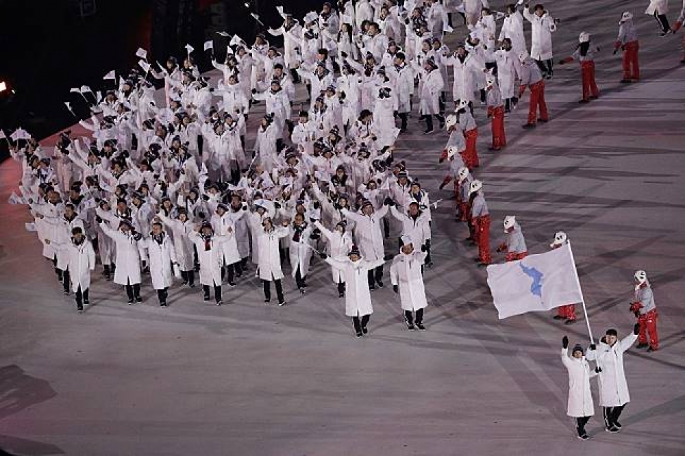 南北韓運動員於開幕式入場。（美聯社）