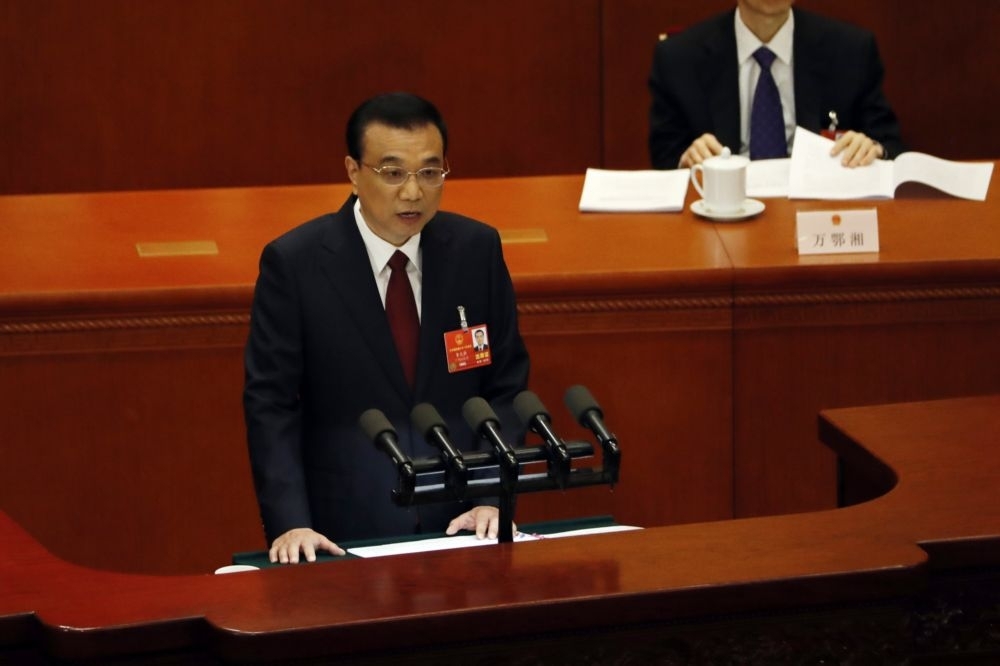 中國國務院總理李克強5日在人大開幕進行工作報告。（湯森路透）