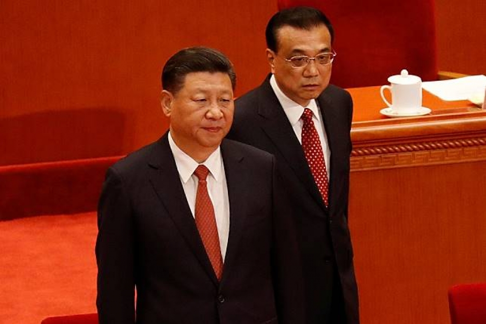 適逢解放軍建軍90周年，中國領導人習近平與國務院總理李克強現身人民大會堂。（湯森路透）