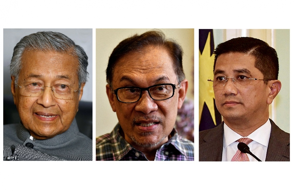 馬來西亞總理馬哈迪（左）、前副總理安華（中）、經濟事務部長阿兹敏（右）。（湯森路透）