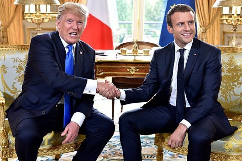法國《星期日報》16 日報導，法國總統馬卡洪表示他對美國總統川普改變《巴黎協定》看法抱持樂觀態度。（湯森路透）