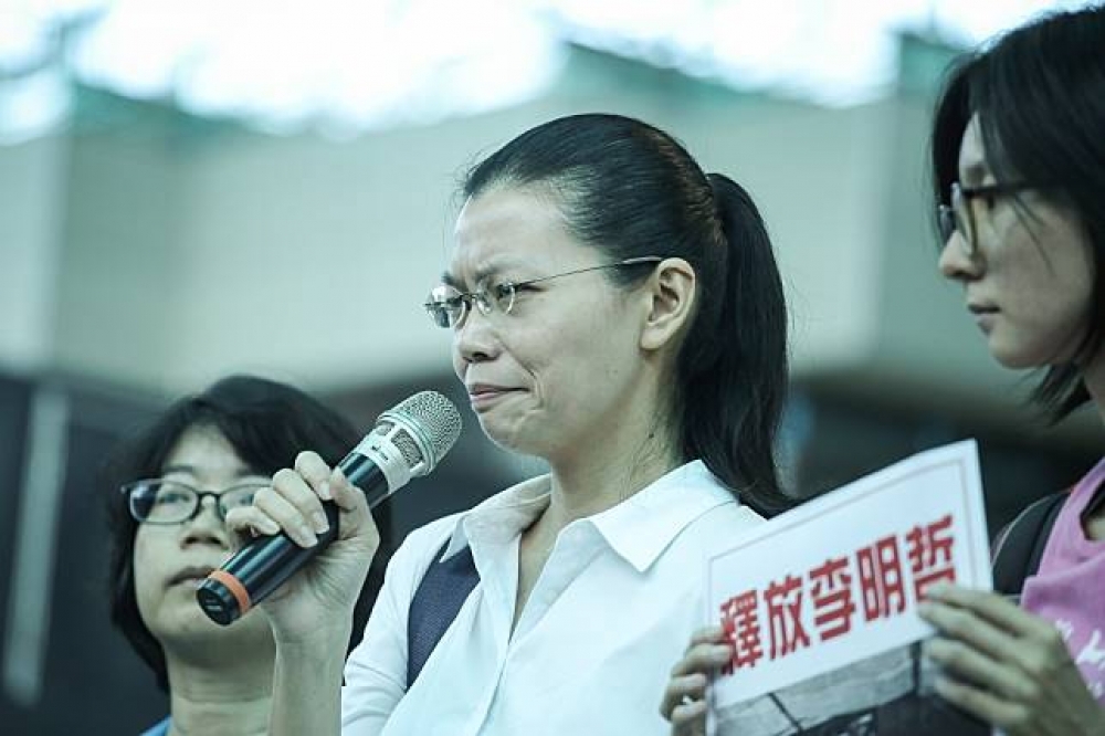 民進黨前黨工李明哲遭中國以「顛覆國家政權罪」逮捕，其妻李淨瑜1日在臉書發表「我為什麼不請律師」聲明。（攝影：陳品佑）