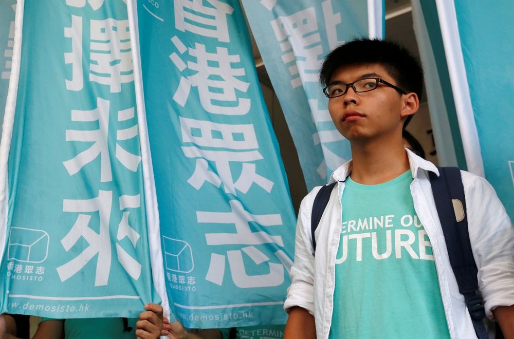 香港學民思潮召集人黃之鋒，因為成功號召12萬香港人上街反對洗腦的「國民教育」，成為香港特區政府的眼中釘。（路透社）