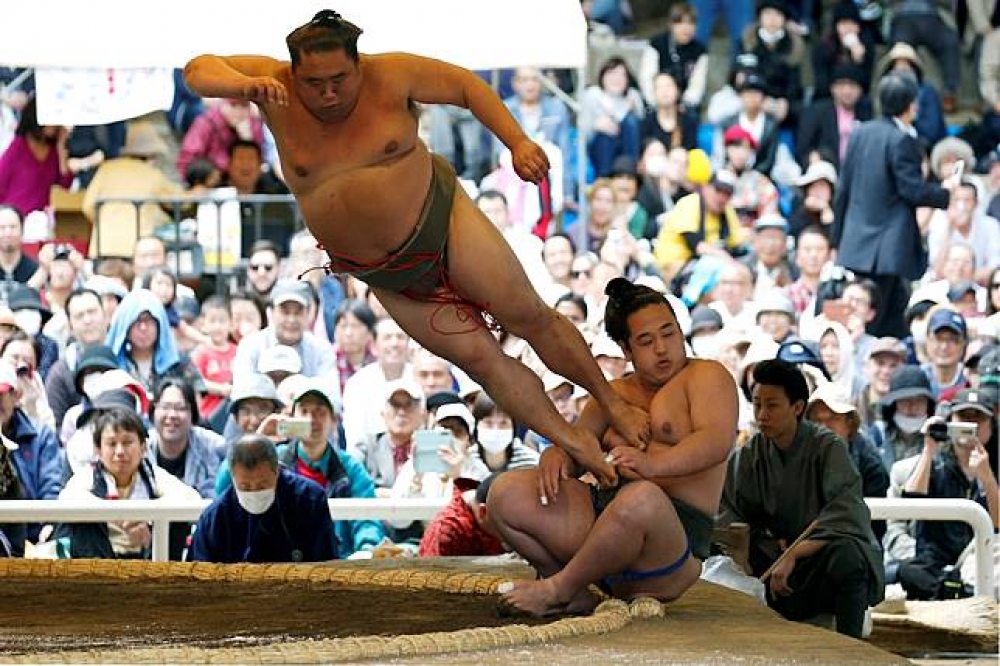 日本東京靖國神社2018年舉辦的相撲錦標賽。（湯森路透）