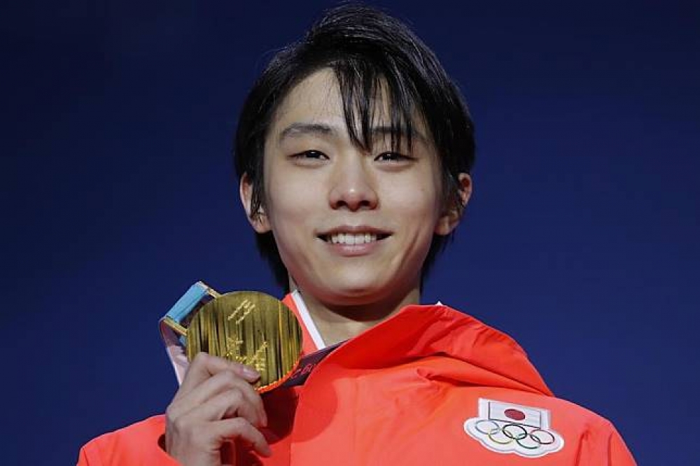 日本「滑冰王子」羽生結弦17日勇奪金牌。（湯森路透）