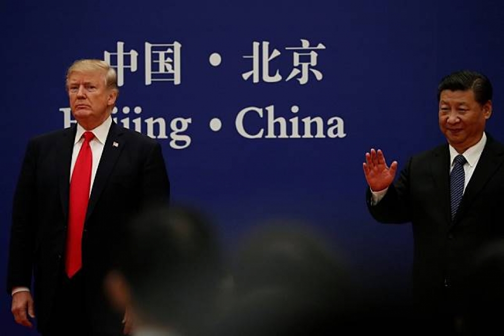 美國總統川普與中國國家主席習近平9日現身北京的人民大會堂。（湯森路透）