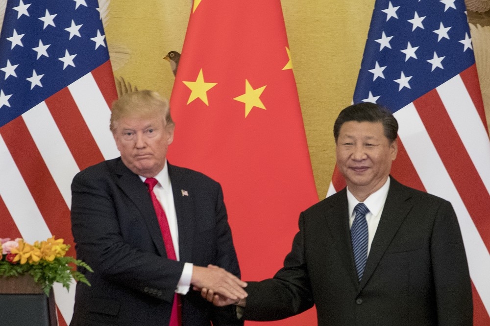 美國總統川普（左）、中國國家主席習近平（右）如何在G20高峰會上互動，備受全球關注。（美聯社）