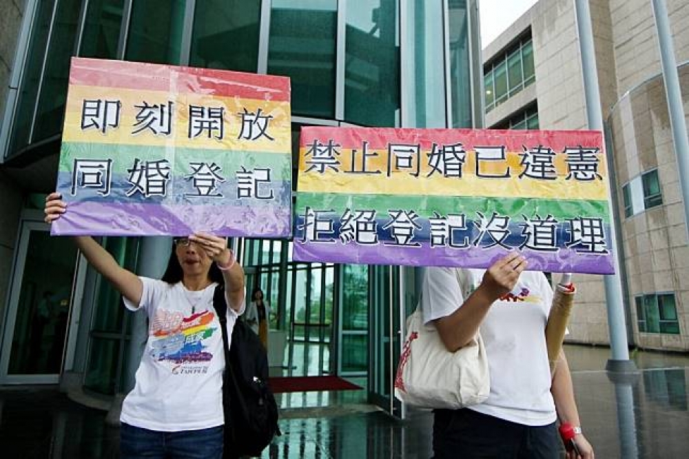 台北高等行政法院12日上午宣判，戶政機關拒絕同志結婚登記已違法，並要求撤銷原處分，但卻未准許同志可以「立即登記結婚」。（攝影：曾原信）