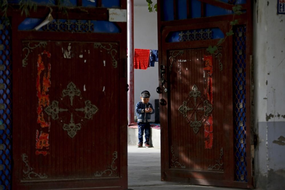 中國新疆和闐的維吾爾族孩童。（美聯社）