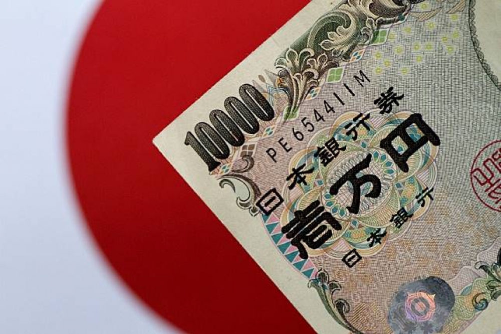 日本民眾受到銀行負利率和稅負加重影響，選擇將現金鎖入保險櫃。（湯森路透）