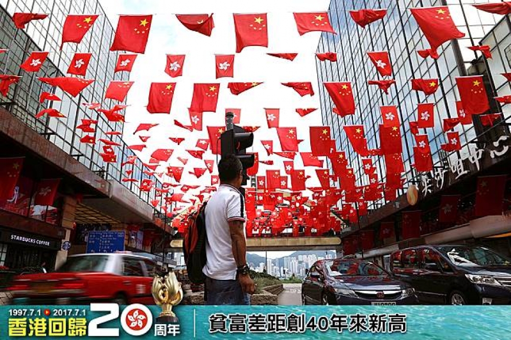 香港即將迎接回歸中國20周年，貧富差距卻創新高。（照片：湯森路透，後製：潘世惟）