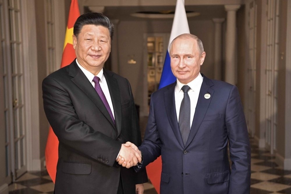 中俄習近平與普京領導人互動友好，兩國關係近幾年更加緊密。（湯森路透）