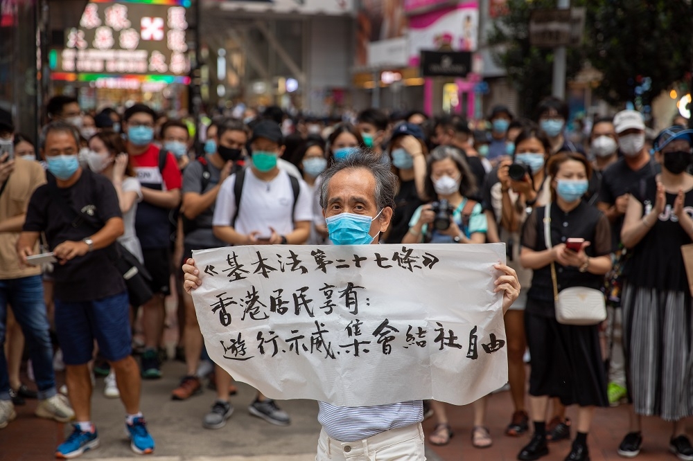 澳門世界新聞攝影展提早取消，圖為香港10月初遊行活動，非這次展出作品。（湯森路透）