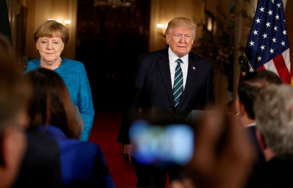 德國總理梅克爾（左）、美國現任總統川普（右）。（湯森路透）