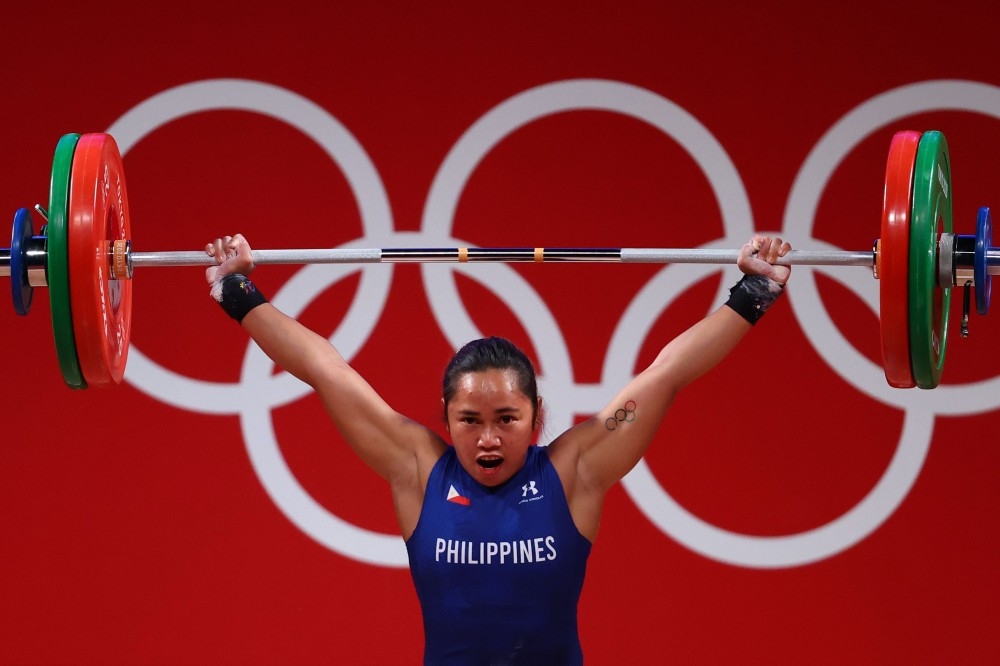 菲律賓舉重好手迪亞茲（Hidilyn Diaz）在女子舉重55公斤級項目以總和224公斤刷新奧運紀律並贏得金牌。（湯森路透）