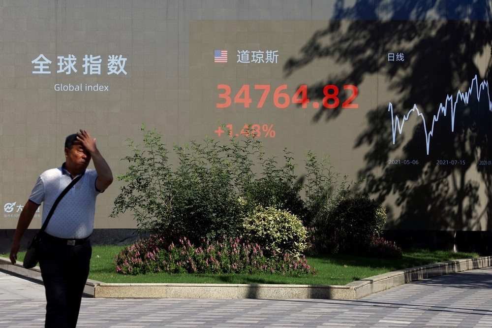 中國官媒批評跨境股票交易平台有法律資安問題。（湯森路透）