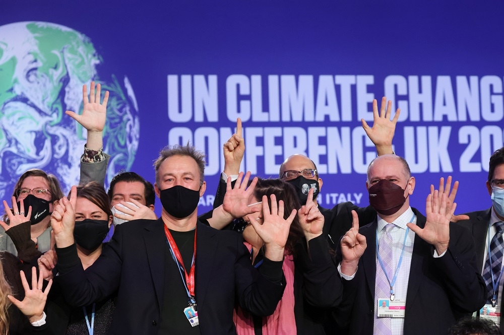 聯合國第26屆氣候高峰會畫下句點，成功達成氣候溫度維持在1.5度的共識。（湯森路透）