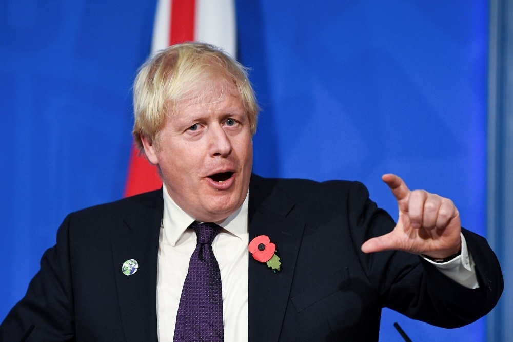 英國首相強森（Boris Johnson）又被發現不戴口罩。（湯森路透）