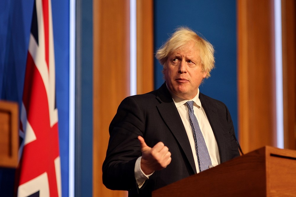 英国首相强森遭披露亲自下令将猫狗撤出阿富汗。（汤森路透）(photo:UpMedia)