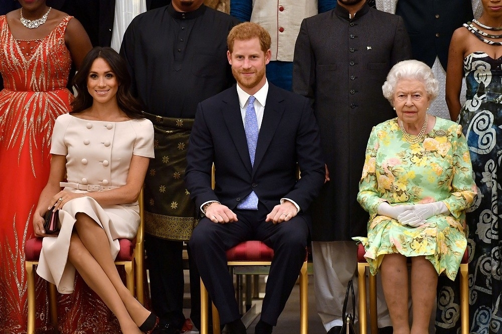 英国女王伊莉莎白二世、哈利王子与梅根。（汤森路透）(photo:UpMedia)