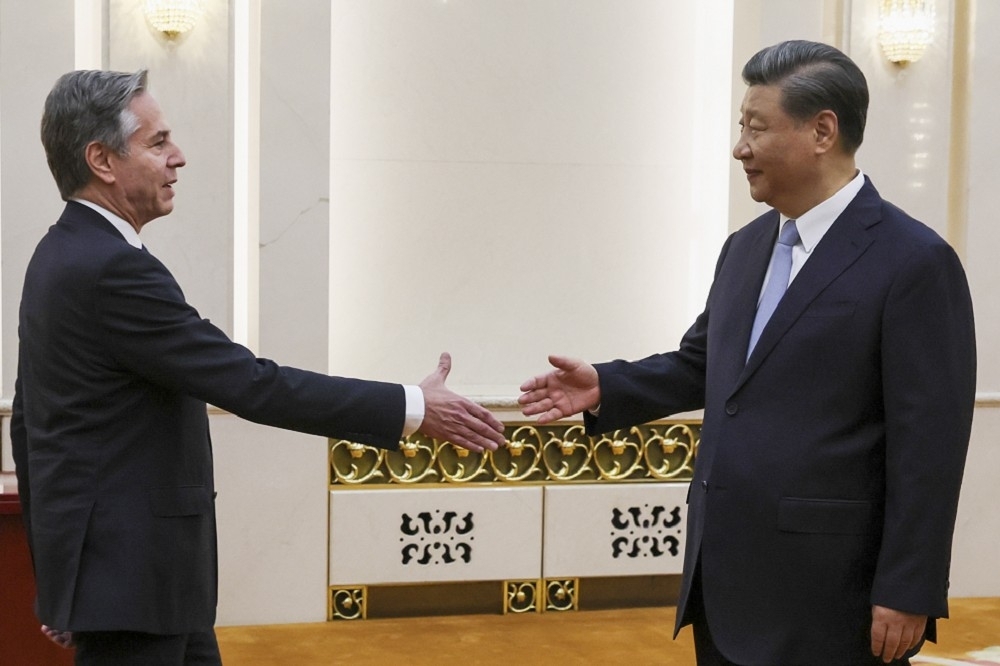 中國領導人習近平19日在北京會見來訪的美國國務卿布林肯。（美聯社）