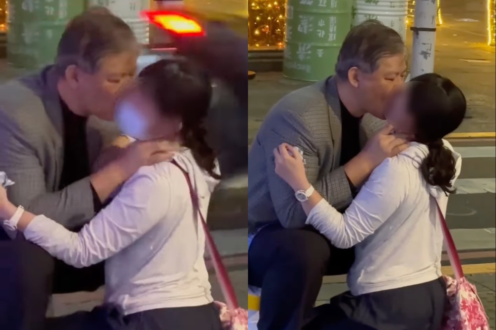 謝靜華2月在街邊與馬尾妹熱吻，遭民眾全拍下。（取自記者爆料網）
