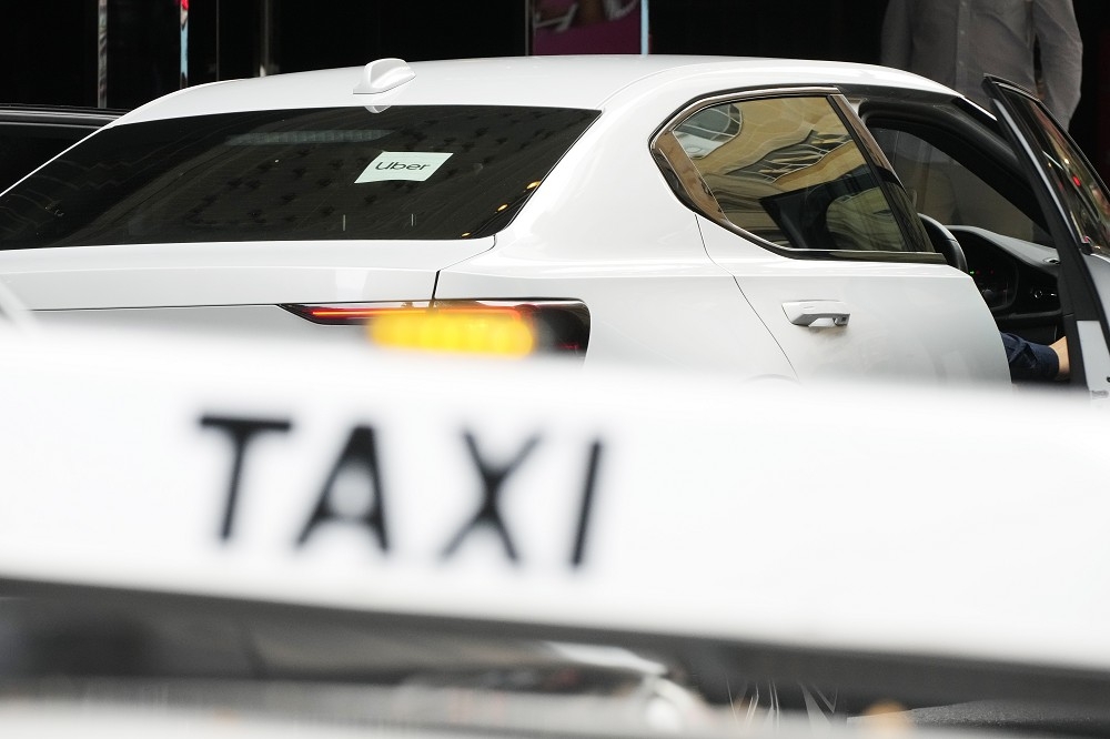 Uber同意支付2.72亿澳元的赔偿给澳洲计程车业者及司机。（美联社）(photo:UpMedia)