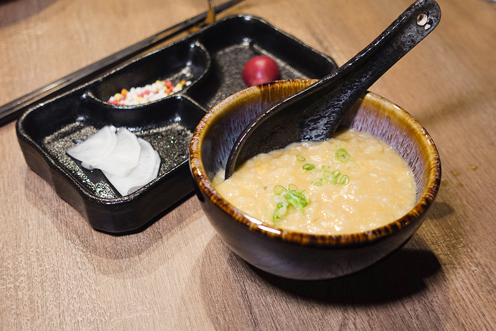 來到「金月 日本鍋料理擔當」，這碗集結全鍋精華的「雜炊」也是不能錯過！